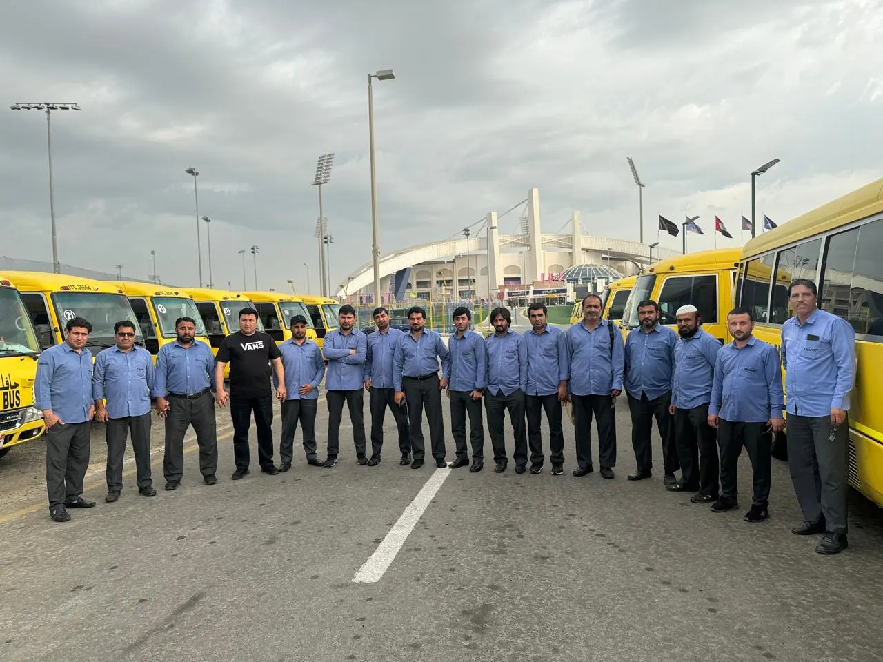 Noor Al Khair school buses with transport staff in Abu Dhabi